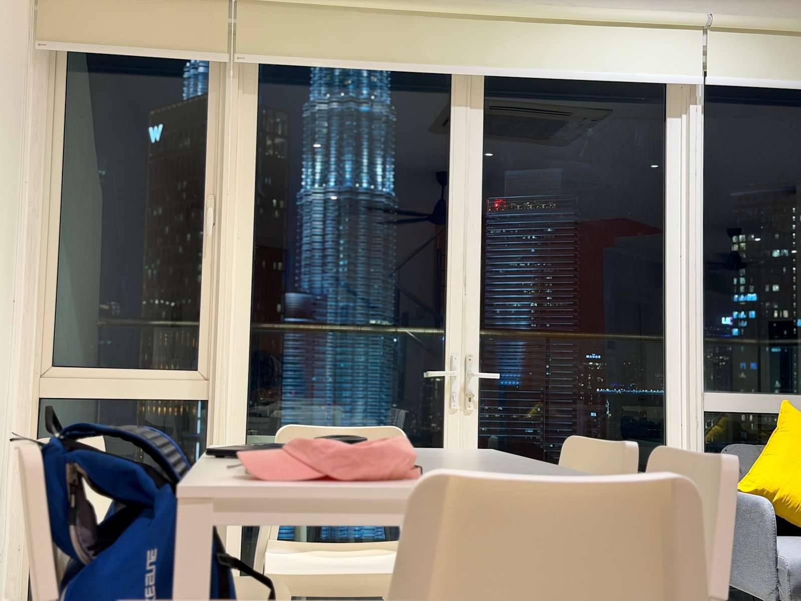 Common area with night skyline view at Poshpack Skyline Hostel