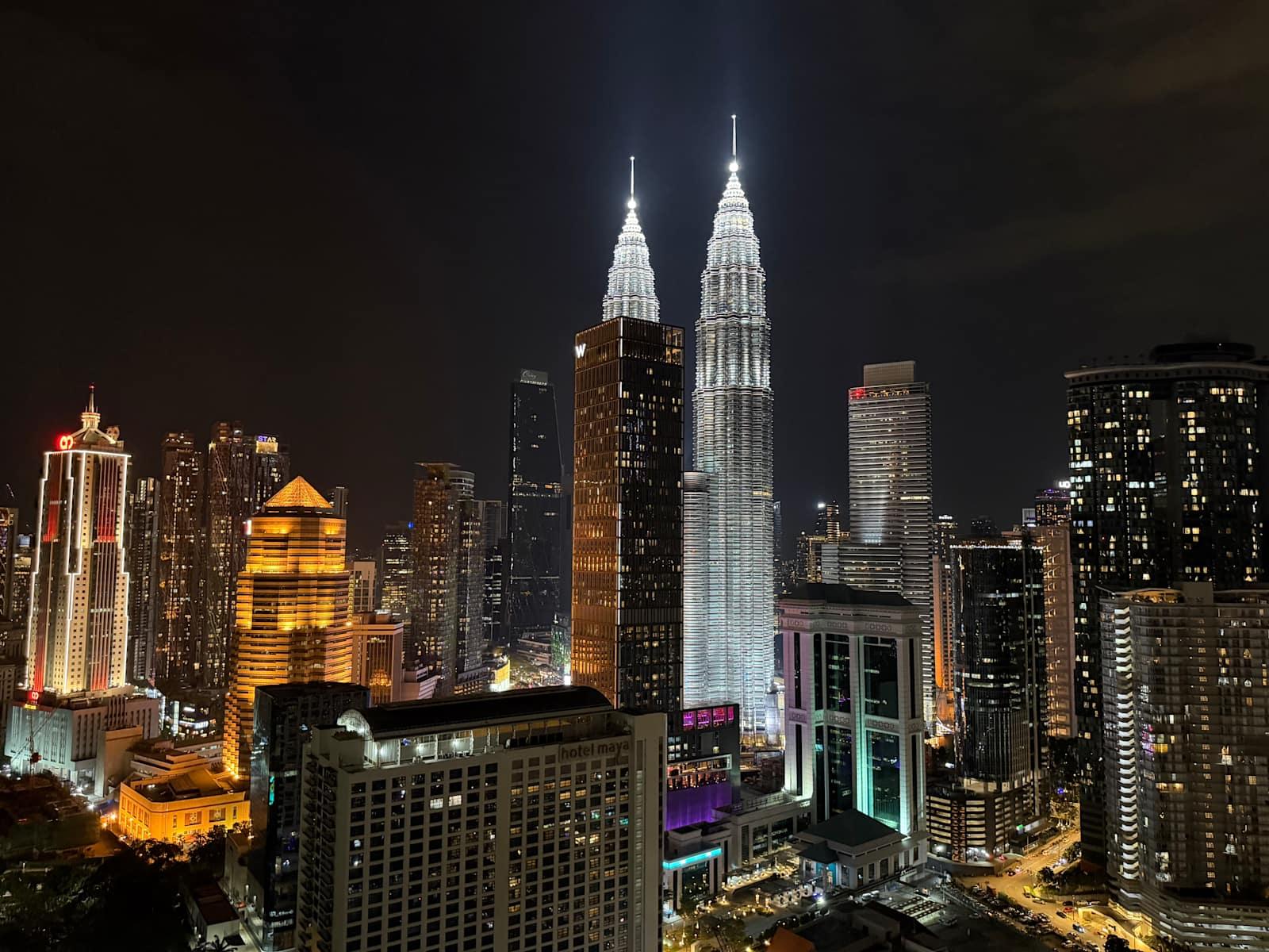 Night panorama of Petronas Twin Towers from hostel in Kuala Lumpur