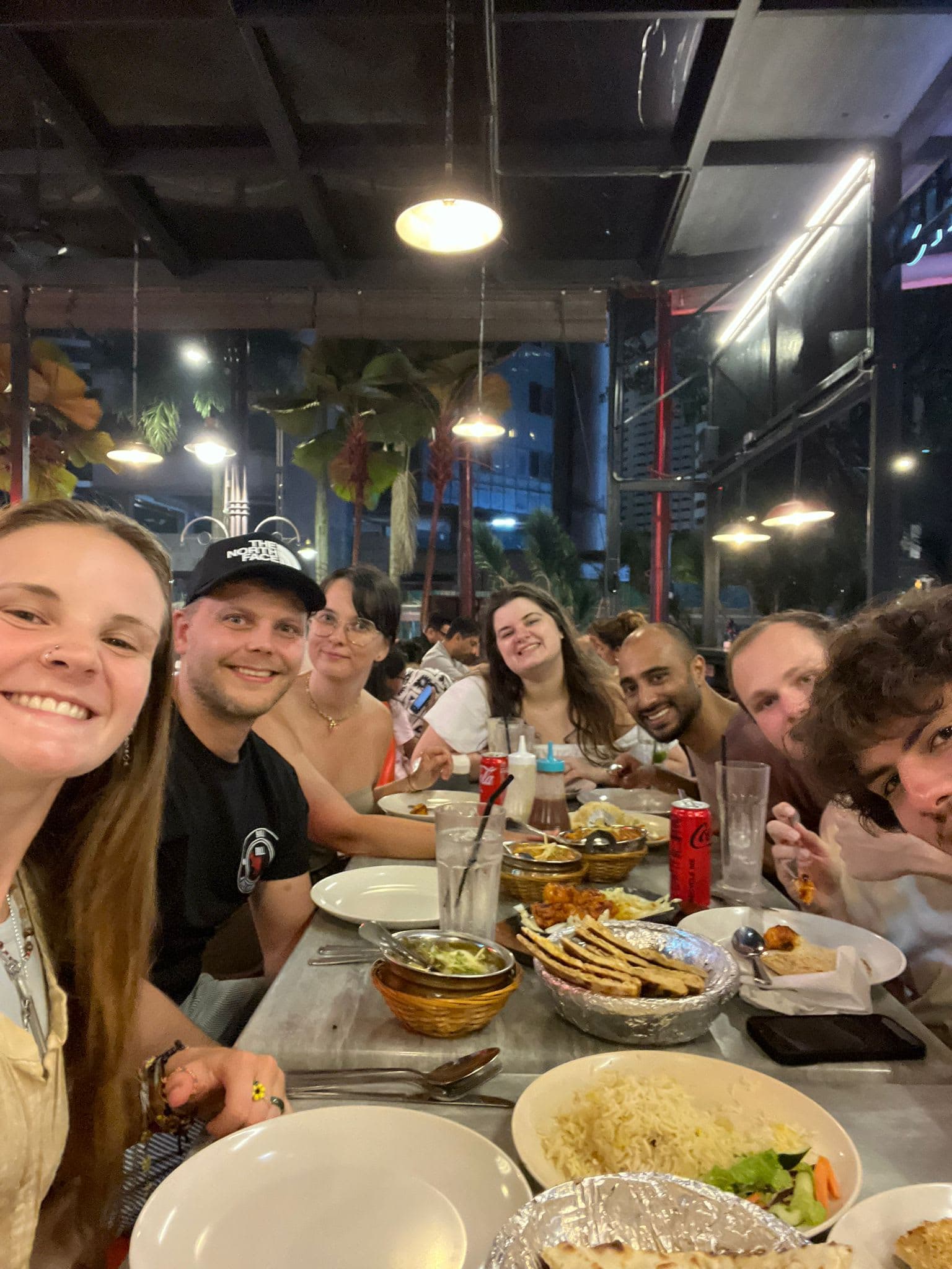 Group of travelers dining together in Kuala Lumpur